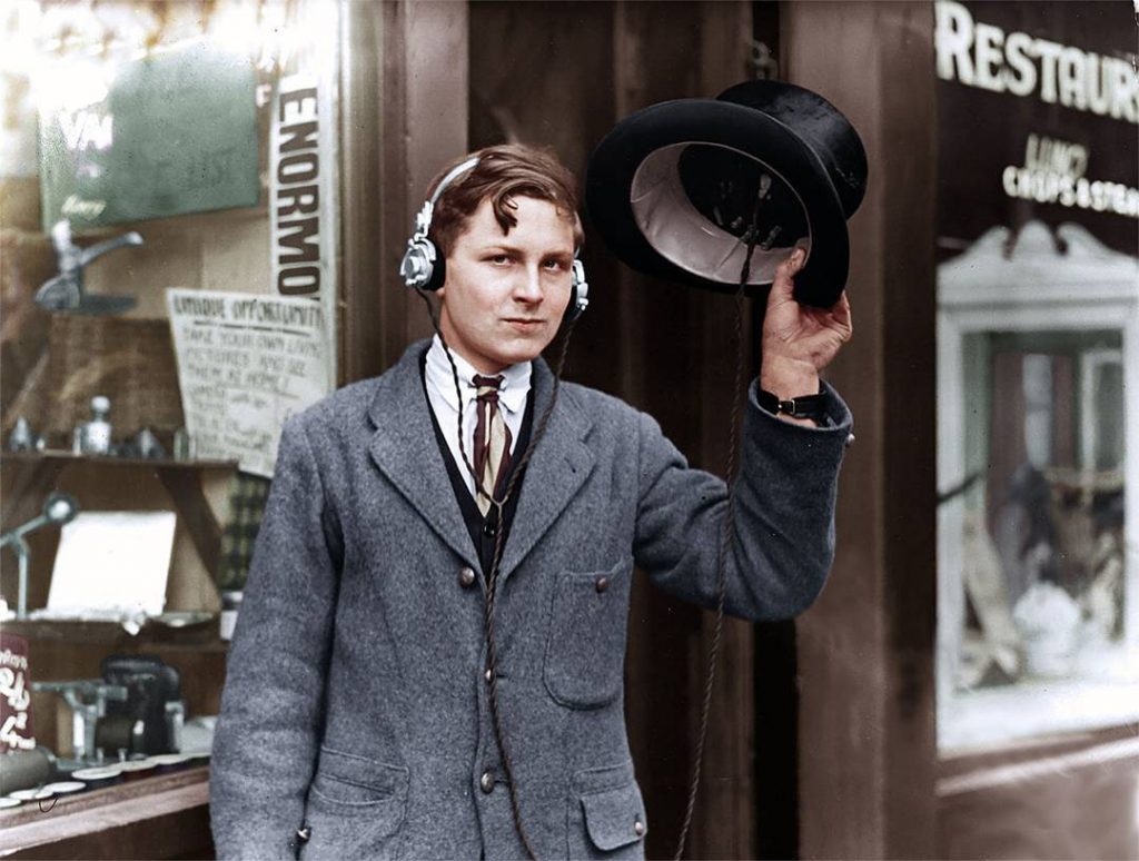 A man in the 1920's wearing headphones